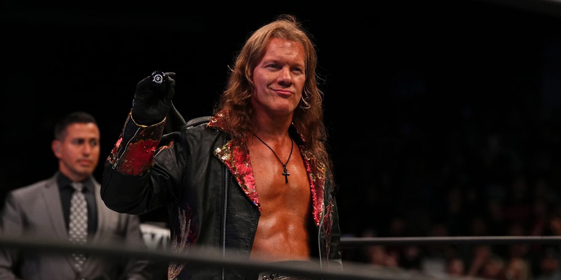 Chris Jericho walks to the ring while wielding a bat before a match on AEW Dynamite in 2022.