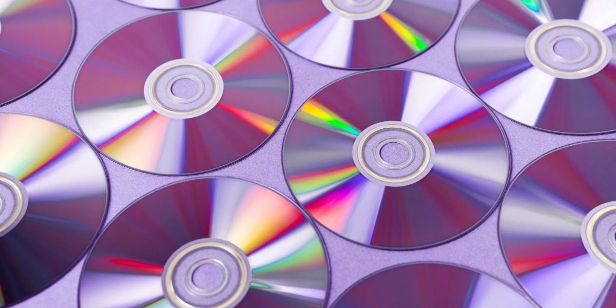 Many Compact Discs are arranged in a row 