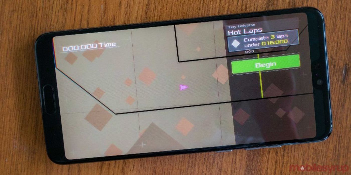 A mobile phone displays a DATA WING mobile game