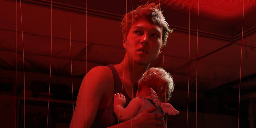 Fragile looks off-screen and holds a baby in the trailer for Death Stranding 2