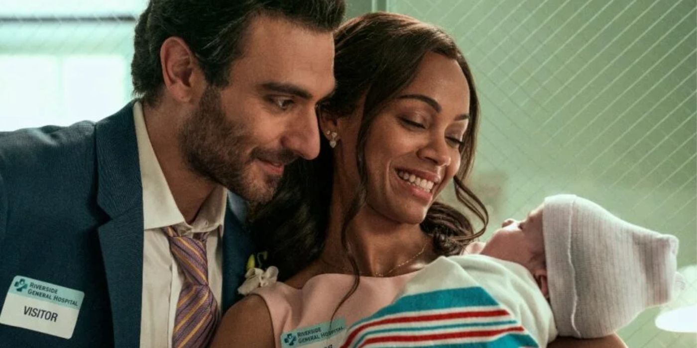 Zoe Saldana and Eugenia Mastrandrea smiling at their adopted child in From Scratch.