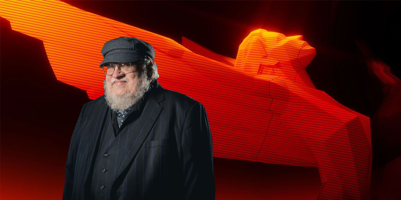 George RR Martin in front of Game Awards Trophy background