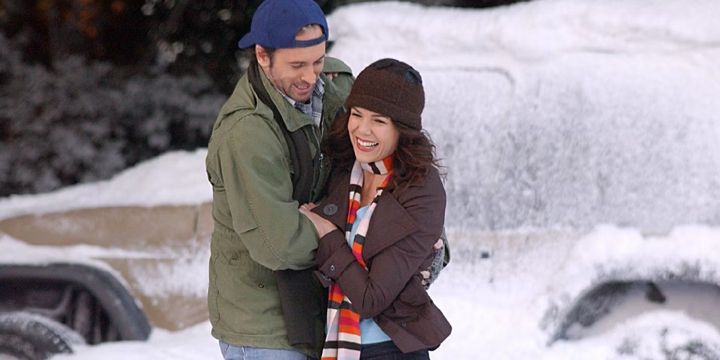 Luke and Lorelai laughing in the snow in the Gilmore Girls episode Women Of Questionable Morals