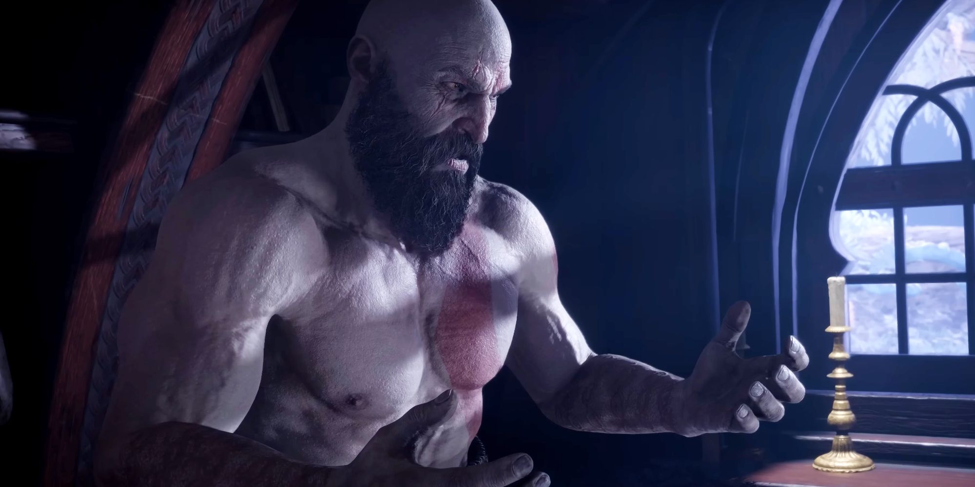 God of War Ragnarok's Kratos sitting on his bed in Sindri's house, looking at his hands.