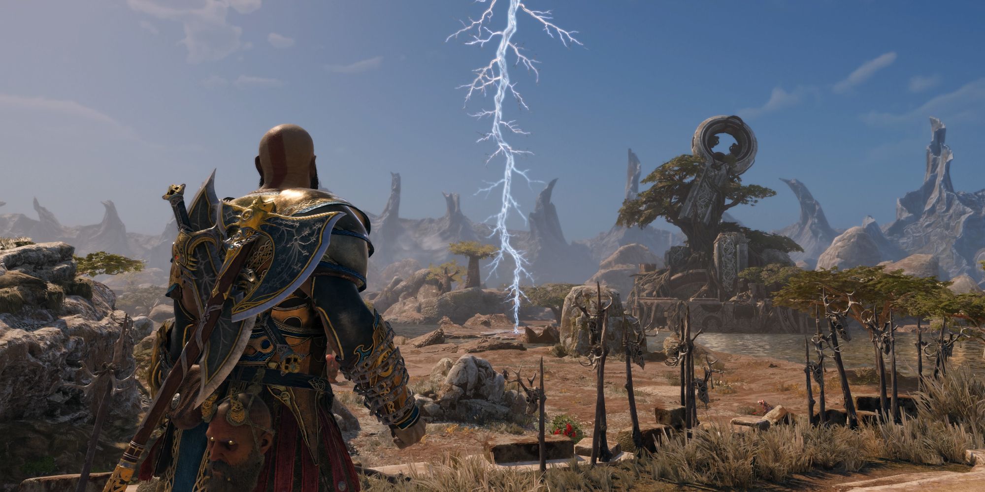 The Vanaheim Crater in God of War Ragnarok. Kratos looks out across a vast plain with a mysterious frozen lightning bolt in the middle. 