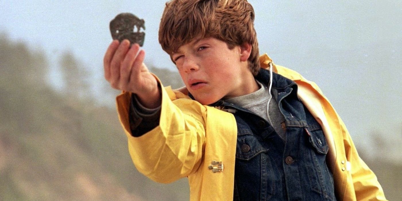 Mikey Walsh holding a treasure piece in The Goonies