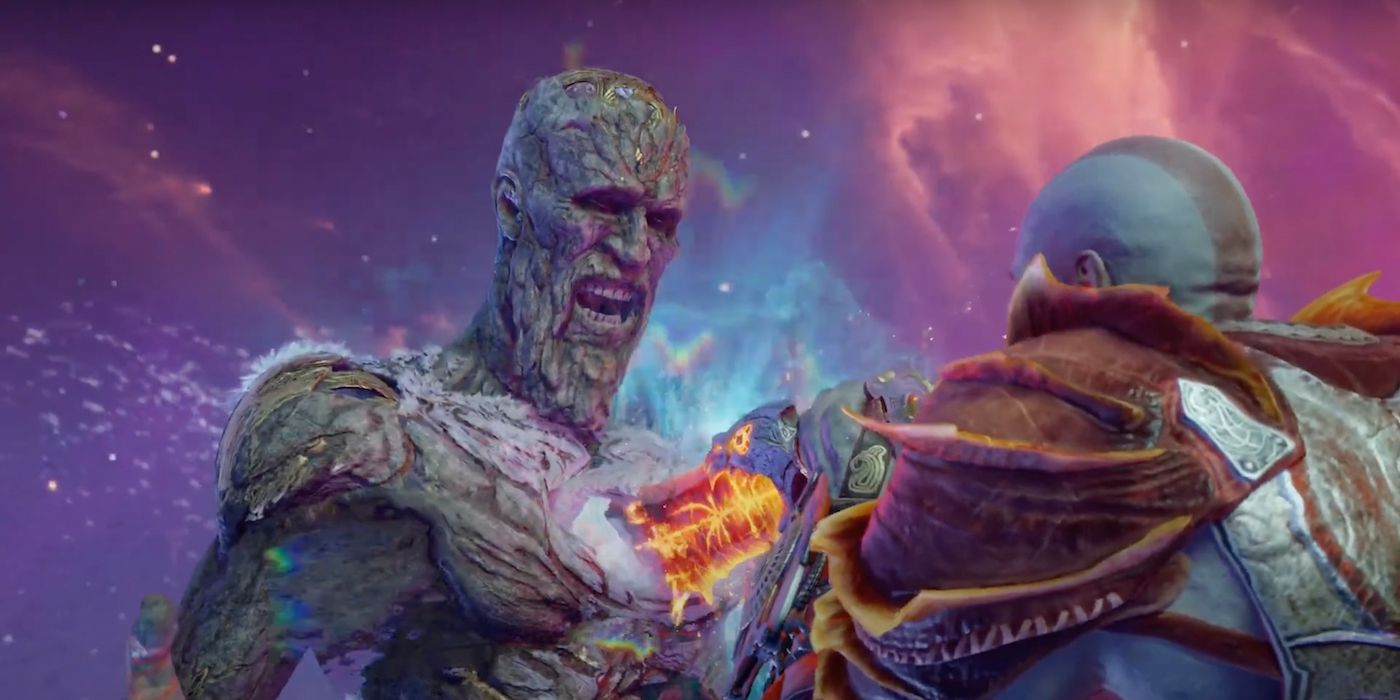 Kratos stabs Surtr with the Blades of Chaos in God of War Ragnarok