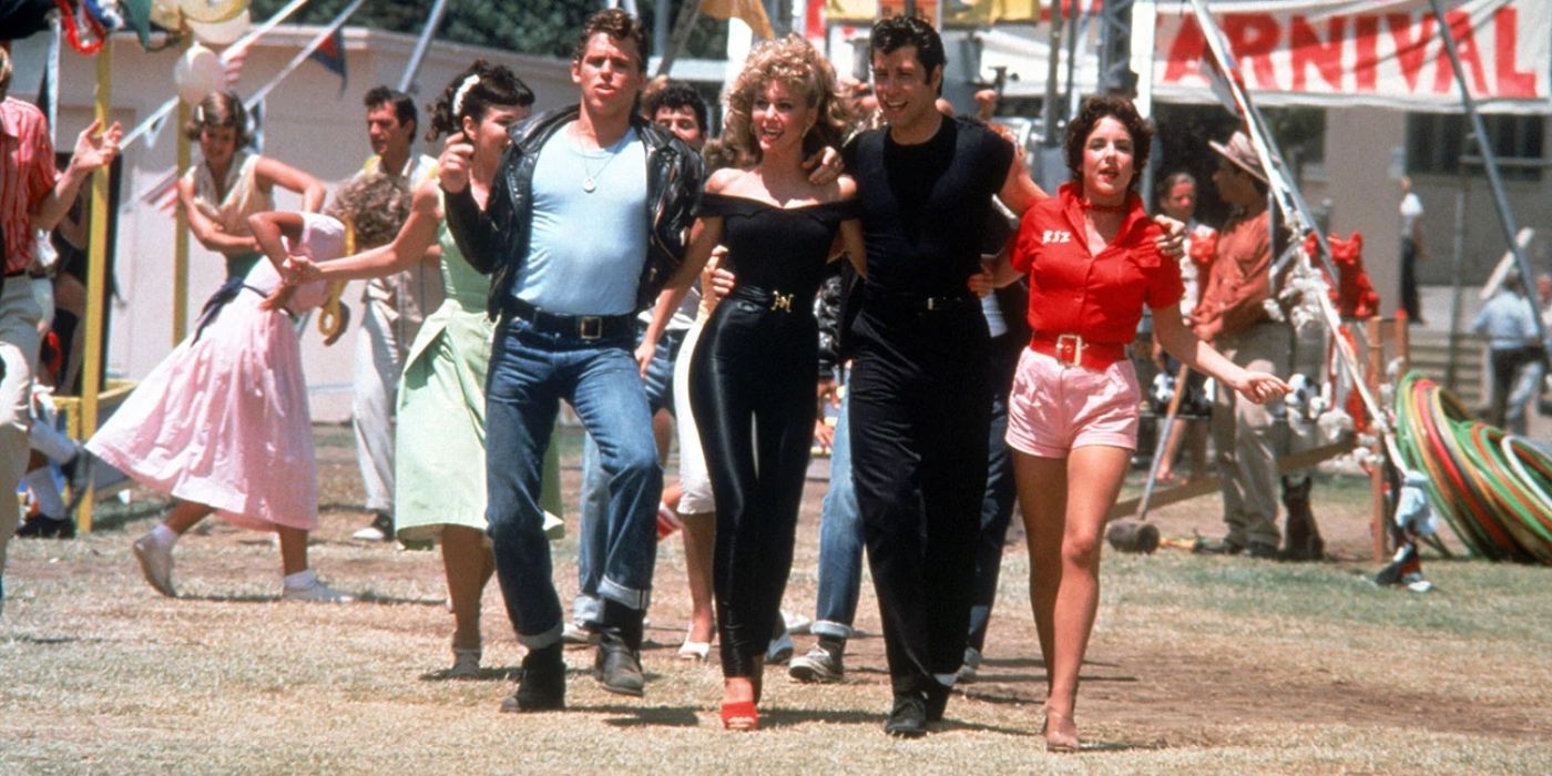 Kenickie, Sandy, Danny and Rizzo walking together in Grease