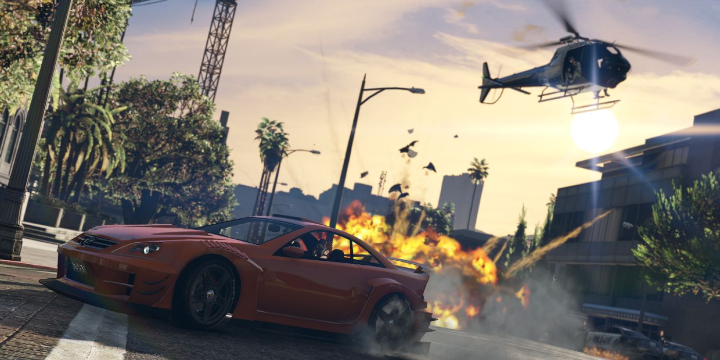 A helicopter chasing a car and trying to explode it in the streets of Los Santos in GTA 5.