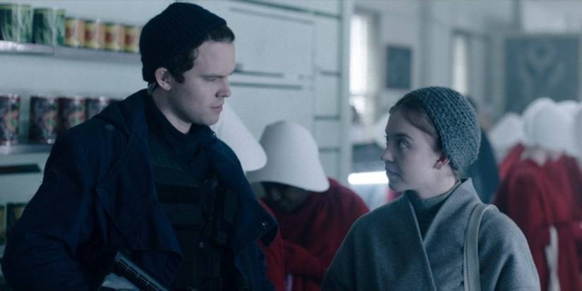 Isaac and Eden talking in The Handmaid's Tale