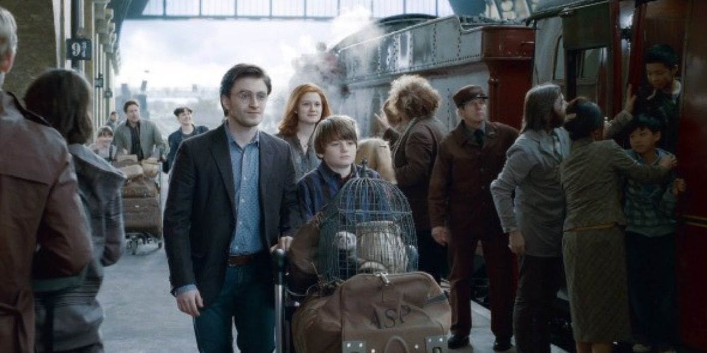 Harry and his on at Kings Cross Station with their luggage while Ginny walks behind them in Harry Potter and the Deathly Hallows Part 2's flashforward