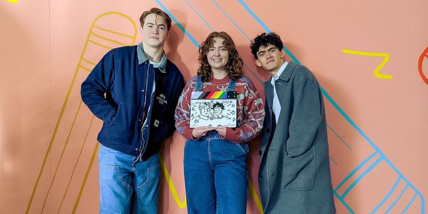 Alice Oseman, Kit Connor and Joe Locke wrap Heartstopper season 2 standing together in BTS image.