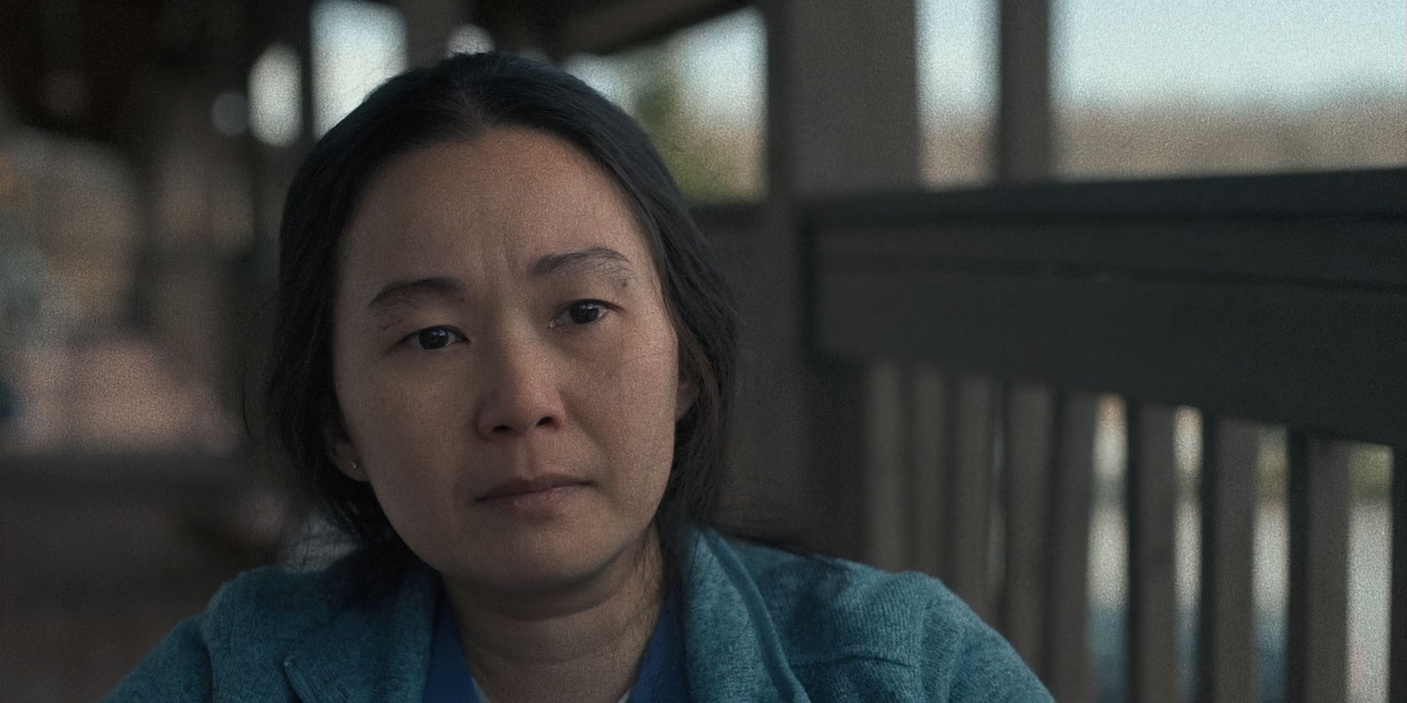 Hong Chau sits on a balcony in The Whale