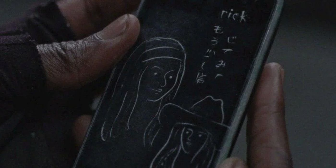 iphone with Rick's name, Japanese writing, and Michonne & Judith's drawings