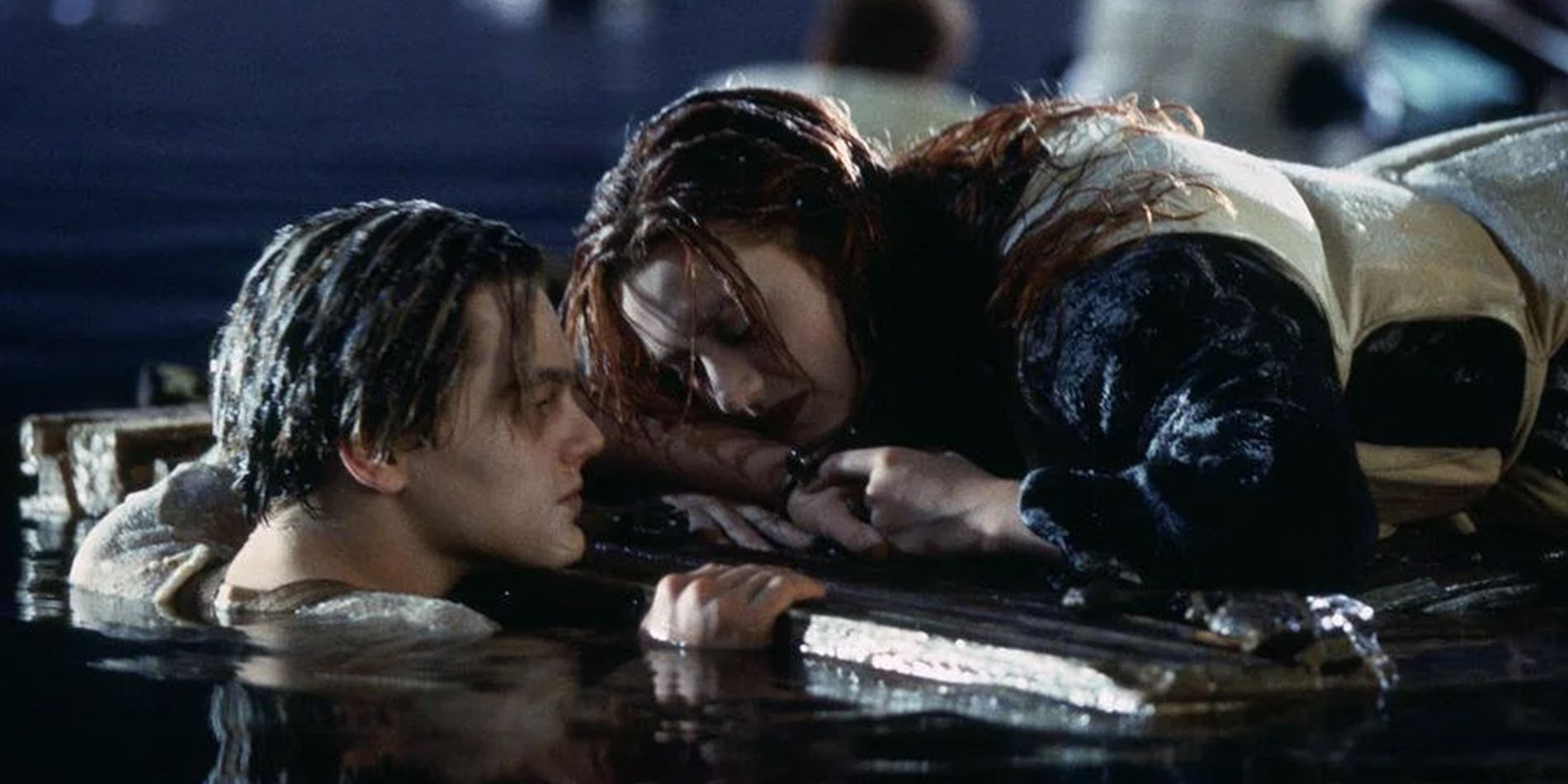Jack and Rose played by Leonardo DiCaprio and Kate Winslet in Titanic at the board holding hands