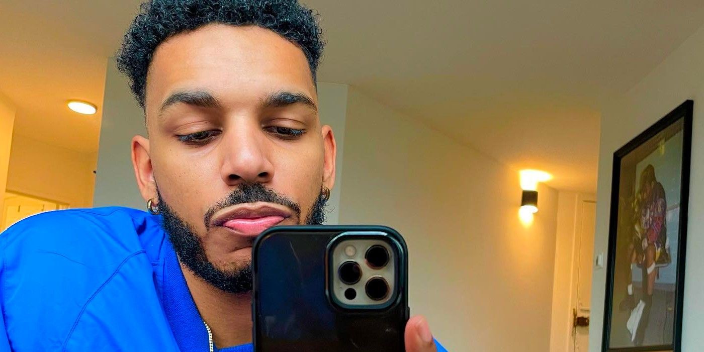 90 Day Fiancé star Kim Menzies' son Jamal Menzies holding camera