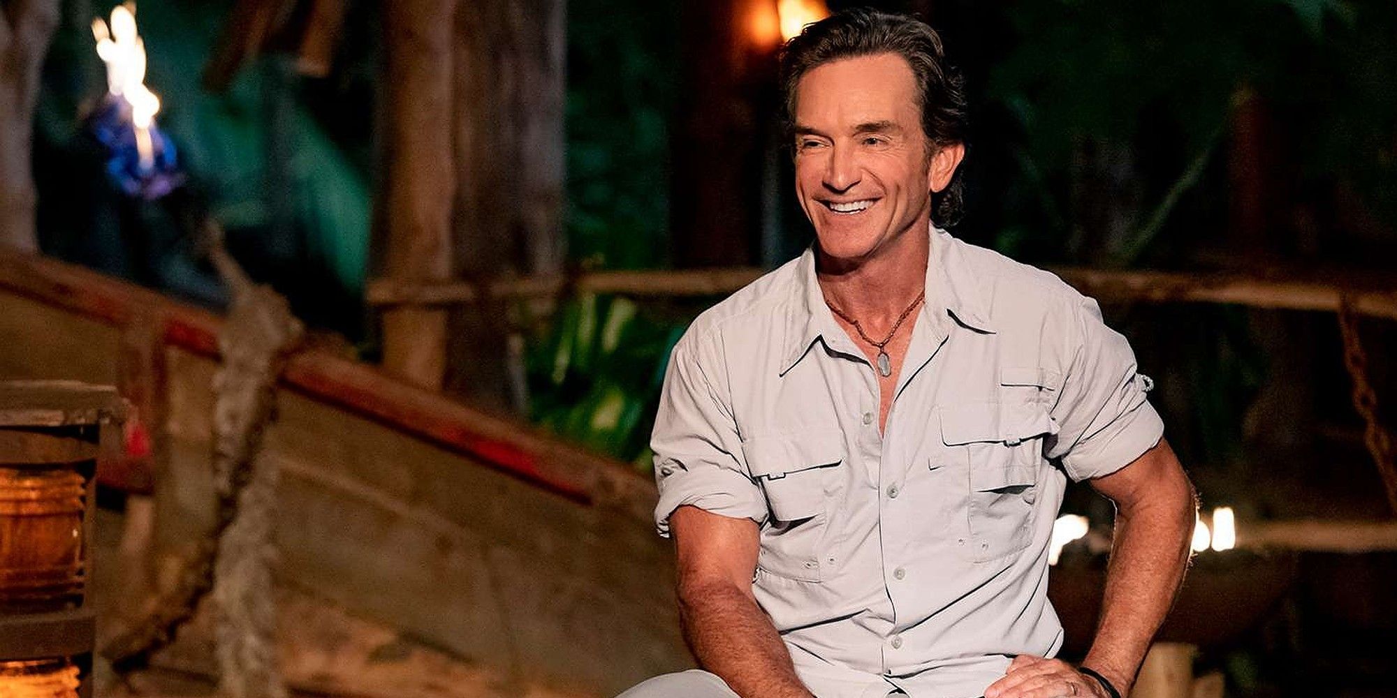 Jeff Probst at Survivor Tribal Council smiling in khaki shirt