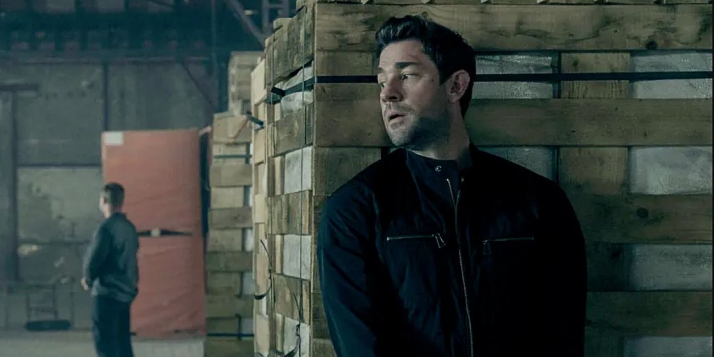 John Krasinski hiding behind a box in Jack Ryan season 3.