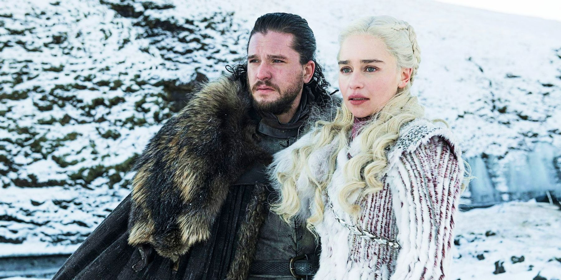 Jon Snow and Daenerys Targaryen stand in front of snowy hill in Game of Thrones