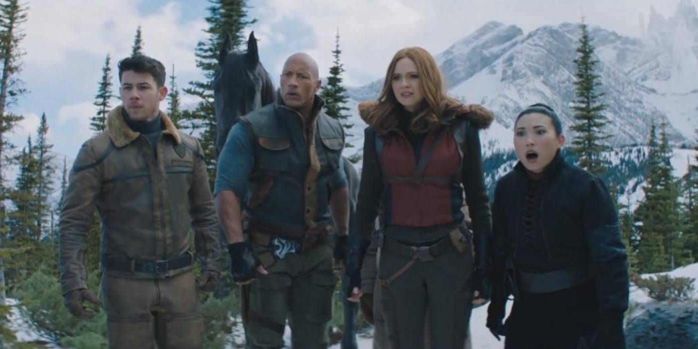 Nick Jonas, Dwayne Johnson, Karen Gillan, and Awkwafina look shocked in Jumanji The Next Level 