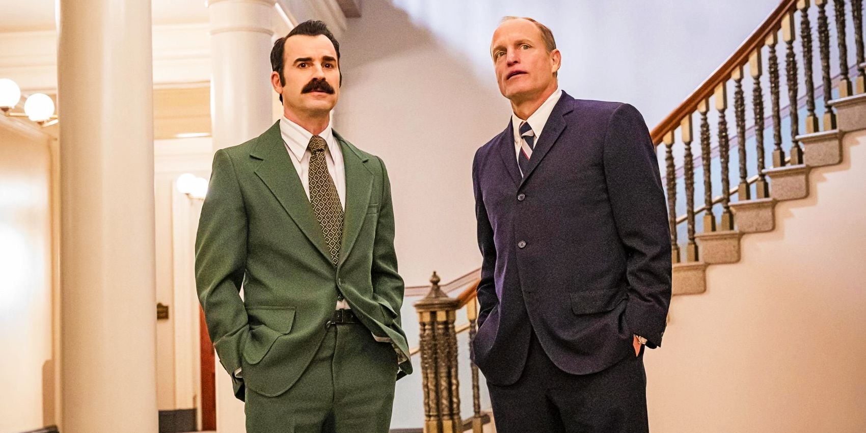 Justin Theroux as G Gordon Liddy and Woody Harrelson as E Howard Hunt standing together in White House Plumbers