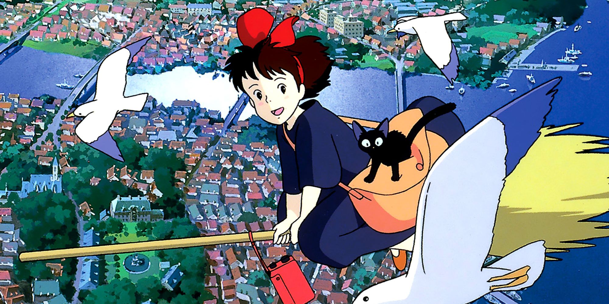 Kiki and Jiji flying high above the city in Kiki’s Delivery Service