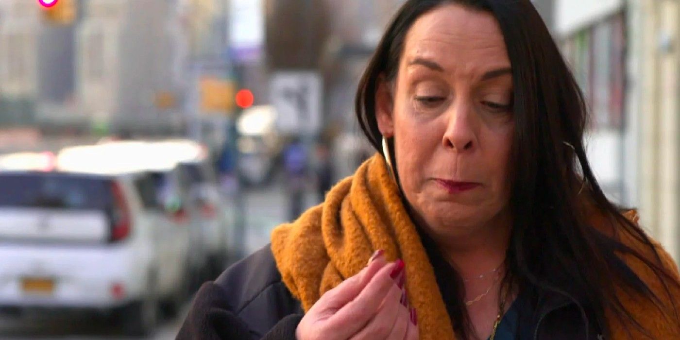 Kim Menzies crying in 90 Day Fiancé out on the street in orange scarf