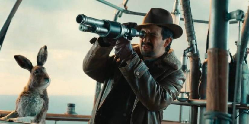 Lee and Hester in a balloon while Lee looks through a telescope in His Dark Materials