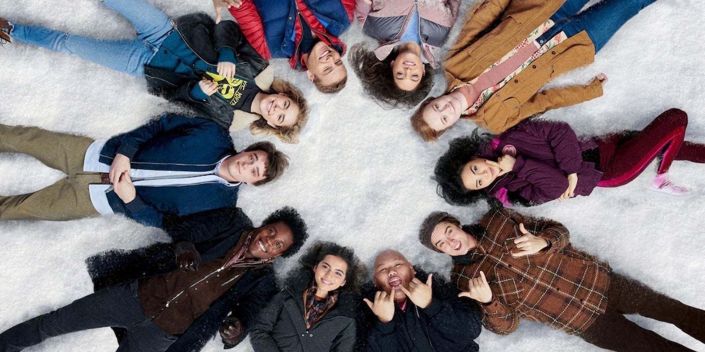 The young cast of Let It Snow laying in a circle in the snow, staring straight up at the camera