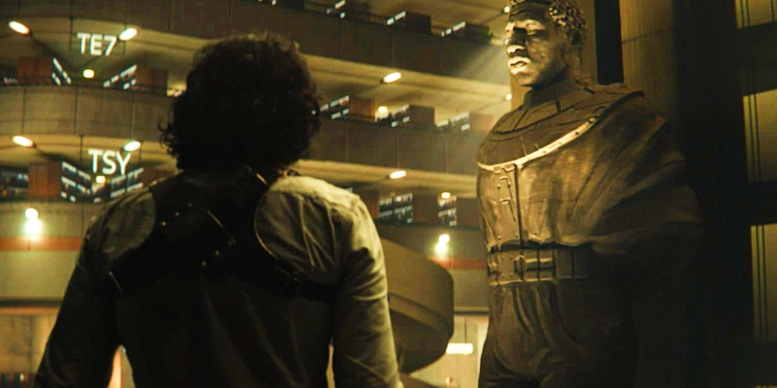Loki from the back staring at the TVA&rsquo;s Kang statue.