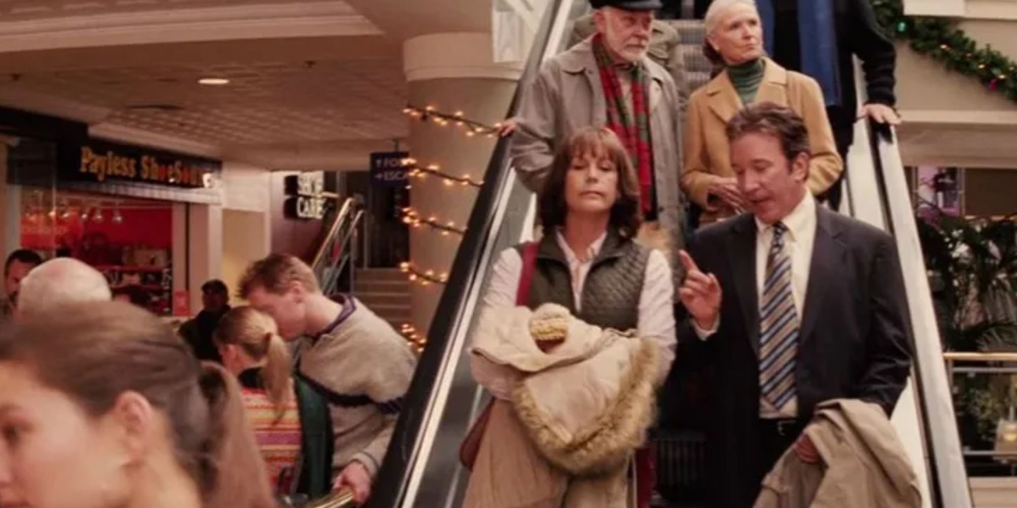 Luther and Nora riding the escalator in Christmas with the Kranks