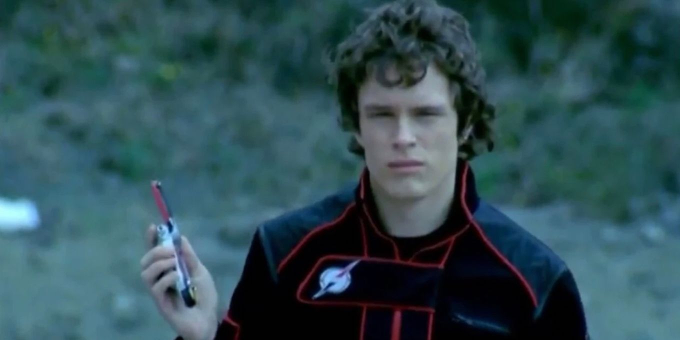 Mack holding his morpher in Power Rangers Operation Overdrive