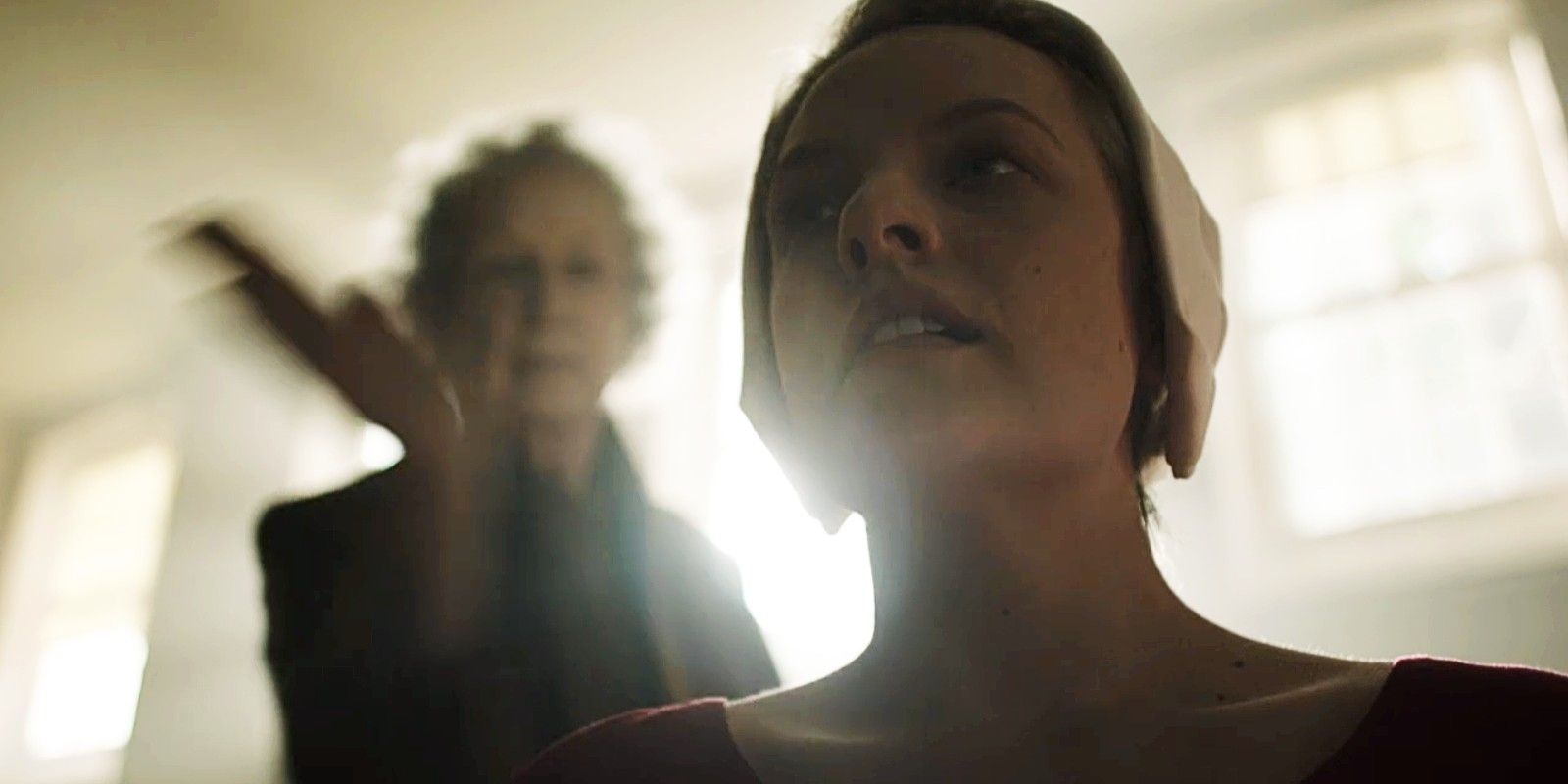 Margaret Atwood as Aunt Margaret and Elizabeth Moss as June Offred in The Handmaid's Tale S01E01
