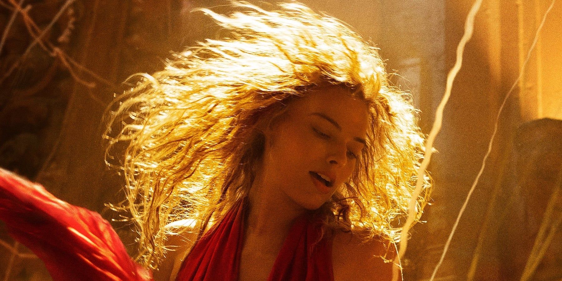 Margot Robbie shaking her hair in Babylon