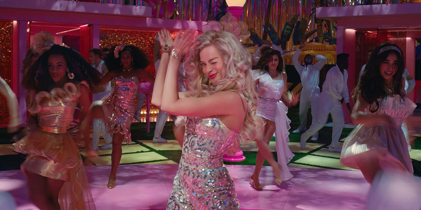 Margot Robbie Winking in sparkly outfit in Barbie