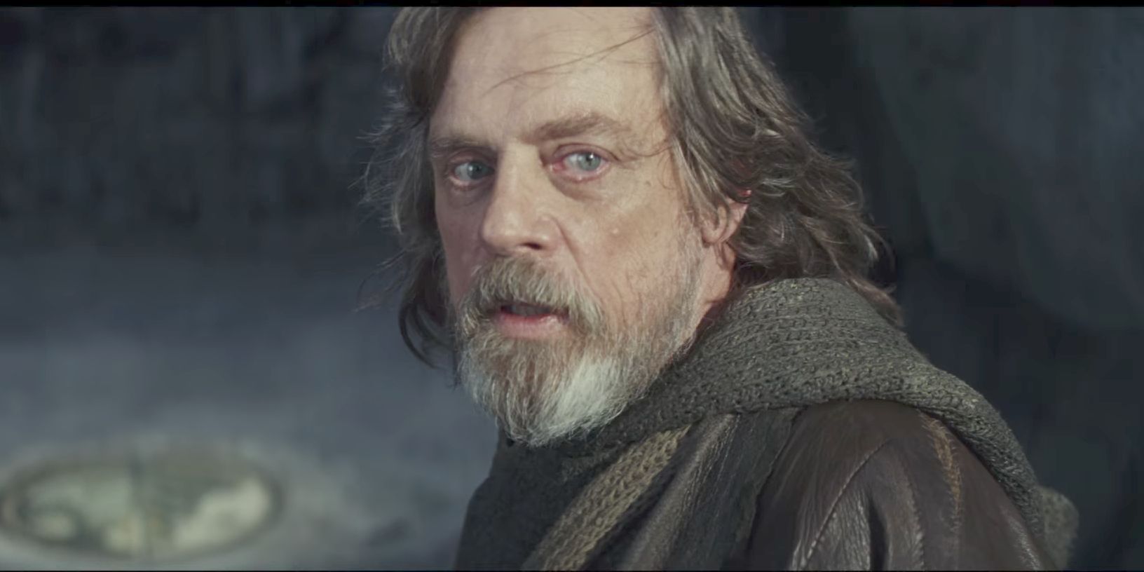 Mark Hamill as Luke Skywalker looking back near the end of The Last Jedi