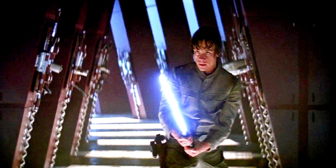 Mark Hamill holding a lightsaber as Luke Skywalker in Star Wars: The Empire Strikes Back.