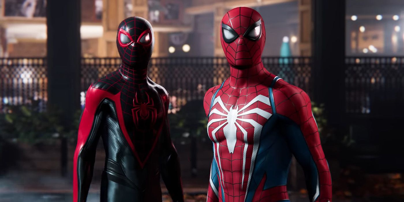 Peter Parker and Miles Morales standing beside each other in their superhero suits in Marvel's Spiderman 2.