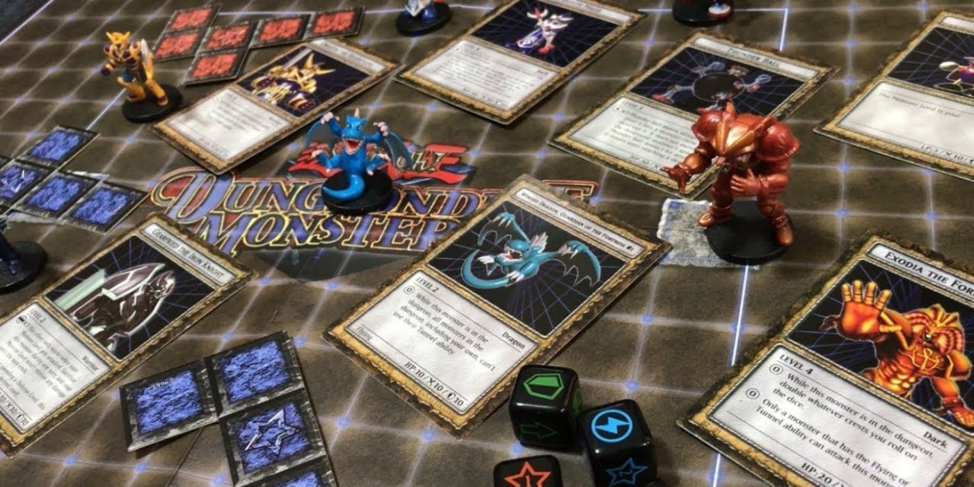 The board of Dungeon Dice Monsters with board, cards, dice, and figures originally from Yugioh.