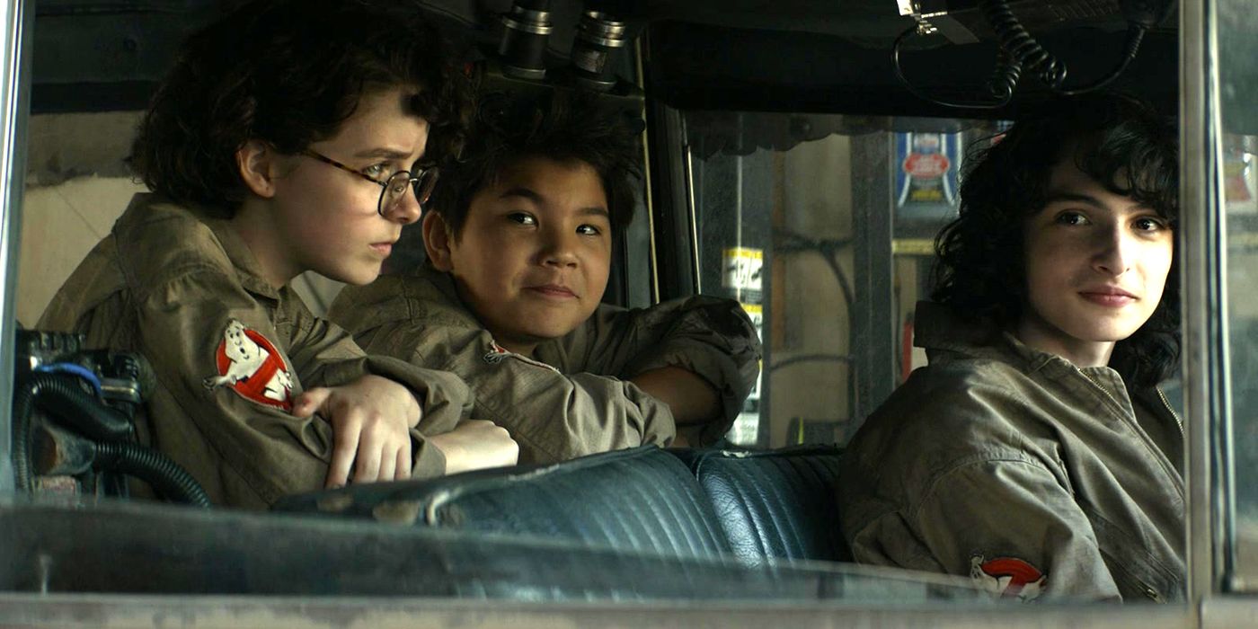 Mckenna Grace and Finn Wolfhard in the Ghostbusters car in Ghostbusters Afterlife