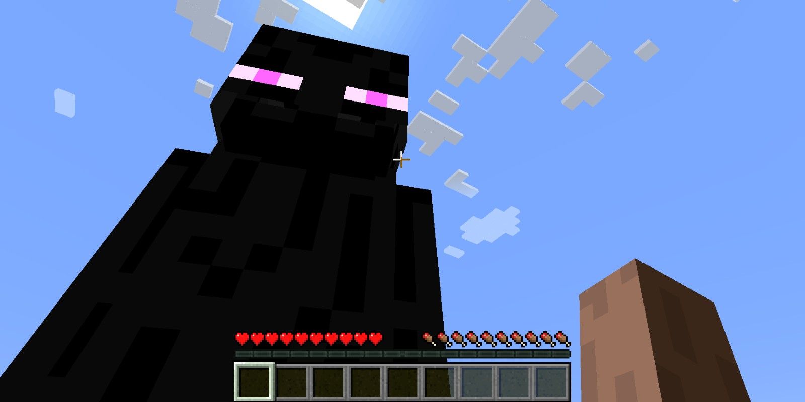 Visão em primeira pessoa de um jogador olhando para um Enderman no Minecraft.
