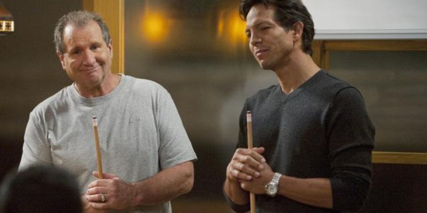 Jay and Javier standing together on Modern Family