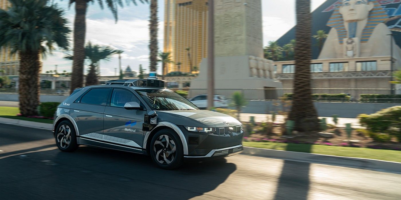 Motional and Uber's Hyundai Ioniq 5 driverless car on a palm-lined street