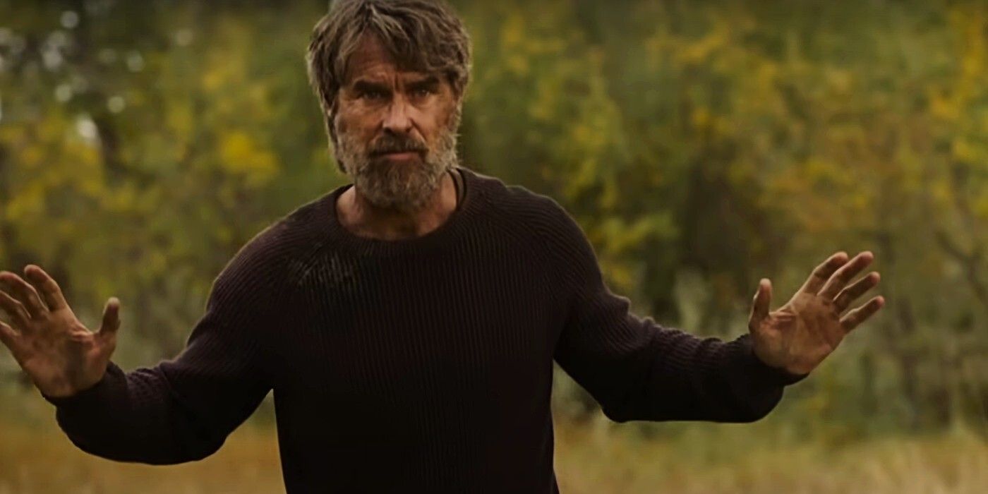 murray bartlett as frank holding up his hands in the last of us