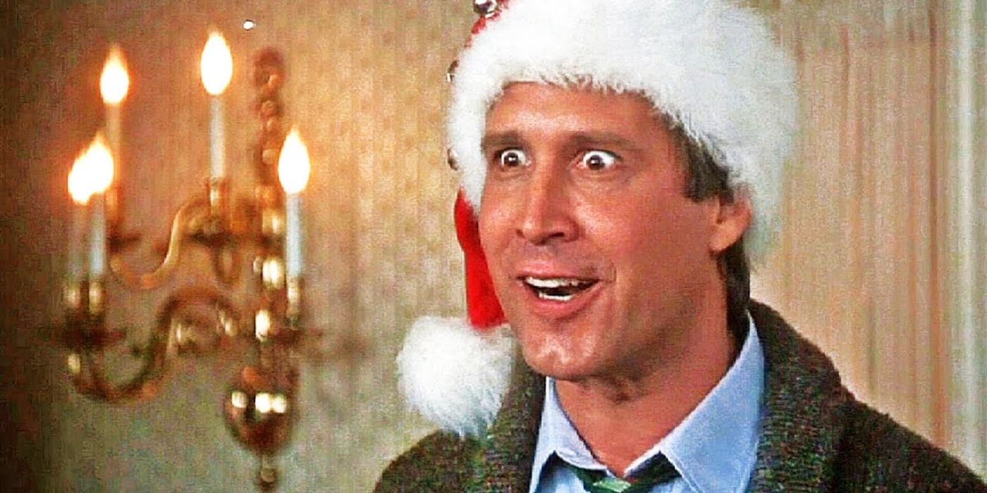 Clark smiling with a Santa hat on in Christmas Vacation