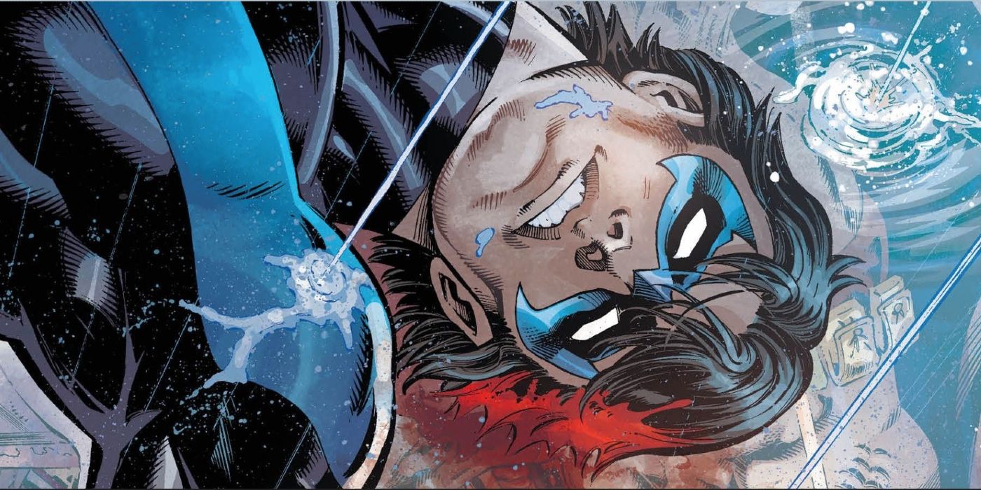 Nightwing lays bleeding in a puddle after being shot in the head by KGBeast