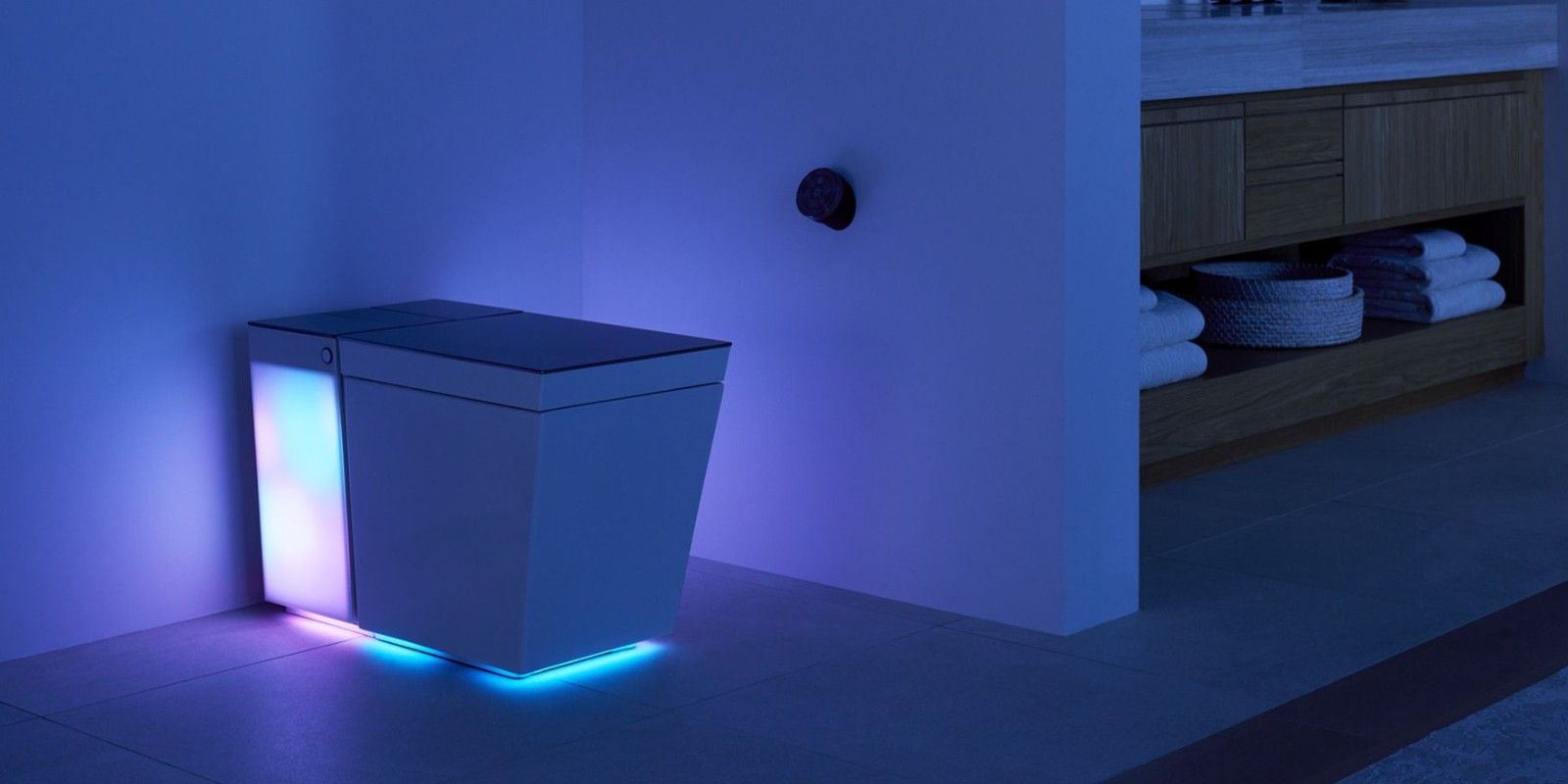 A picture of the Numi 2.0 Intelligent Toilet with its LEDs on