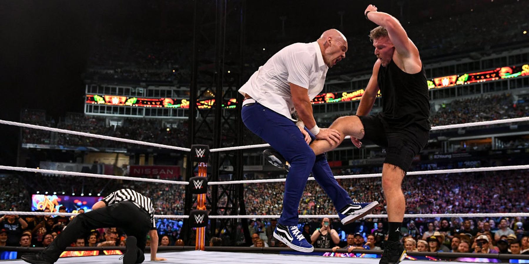 Pat McAfee punts Happy Corbin in the nether regions to finish off their match at WWE SummerSlam.