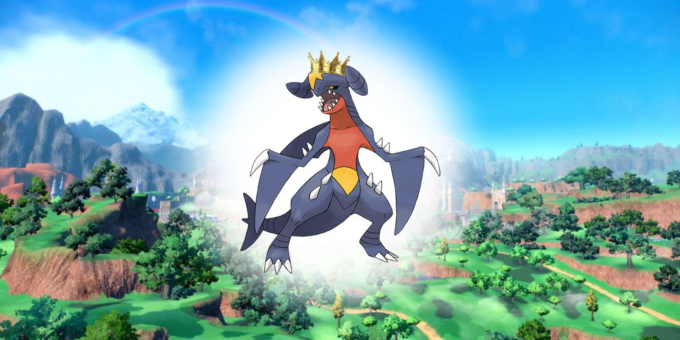 Pokémon Scarlet Violet Garchomp in font of a green lush background with a crown