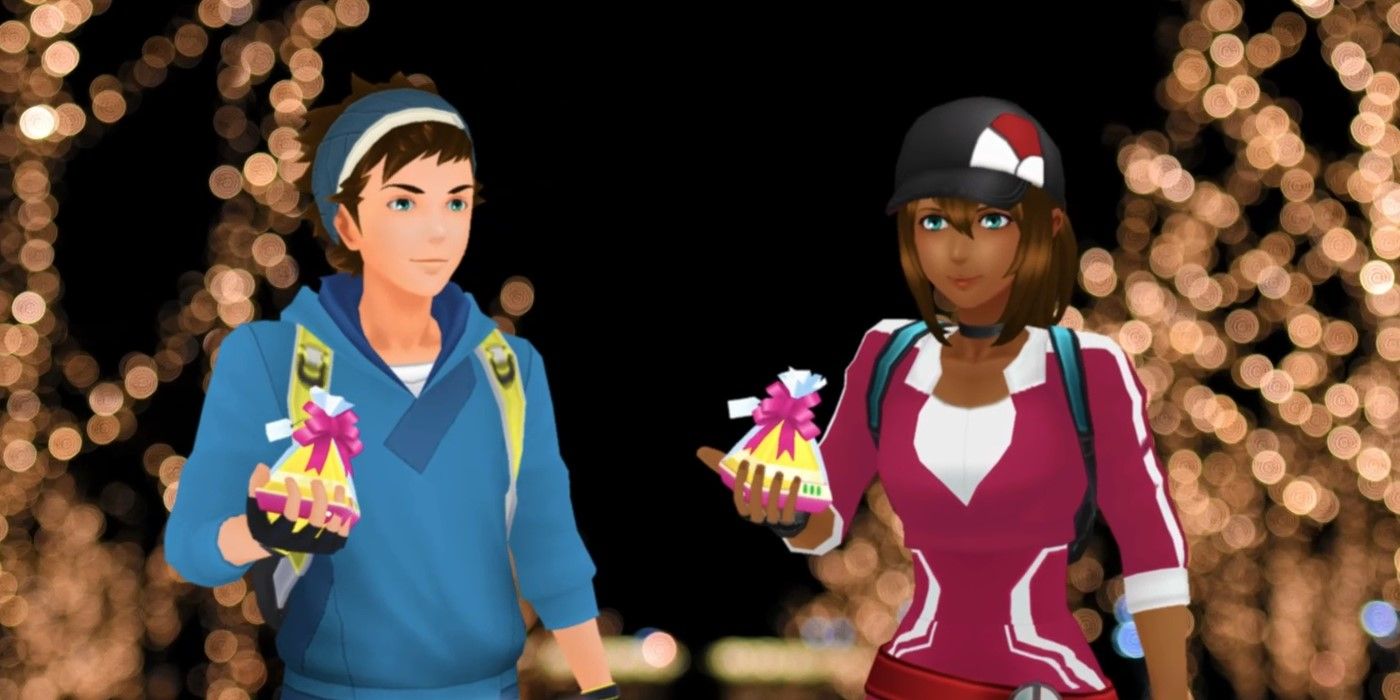 Deux avatars Pokémon Go faisant la pose de cadeaux de vacances d'hiver.